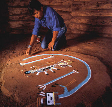 Navajo Indian making a sandpainting